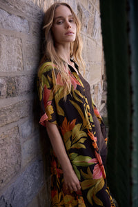 Lifestyle view of Joseph Ribkoff Chiffon Tropical Print Straight Blouse – Style 262949 in black multi