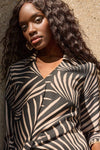 Front view of lifestyle image of Joseph Ribkoff Gauze Tropical Print Top with Tie - Style 251083-BLK/DN