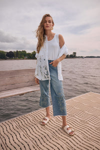 Lifestyle view of Joseph Ribkoff Repreve® Denim Wide Leg Crop Jeans with Embroidery – Style 262915